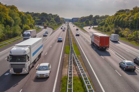 Two way road with cars and trucks